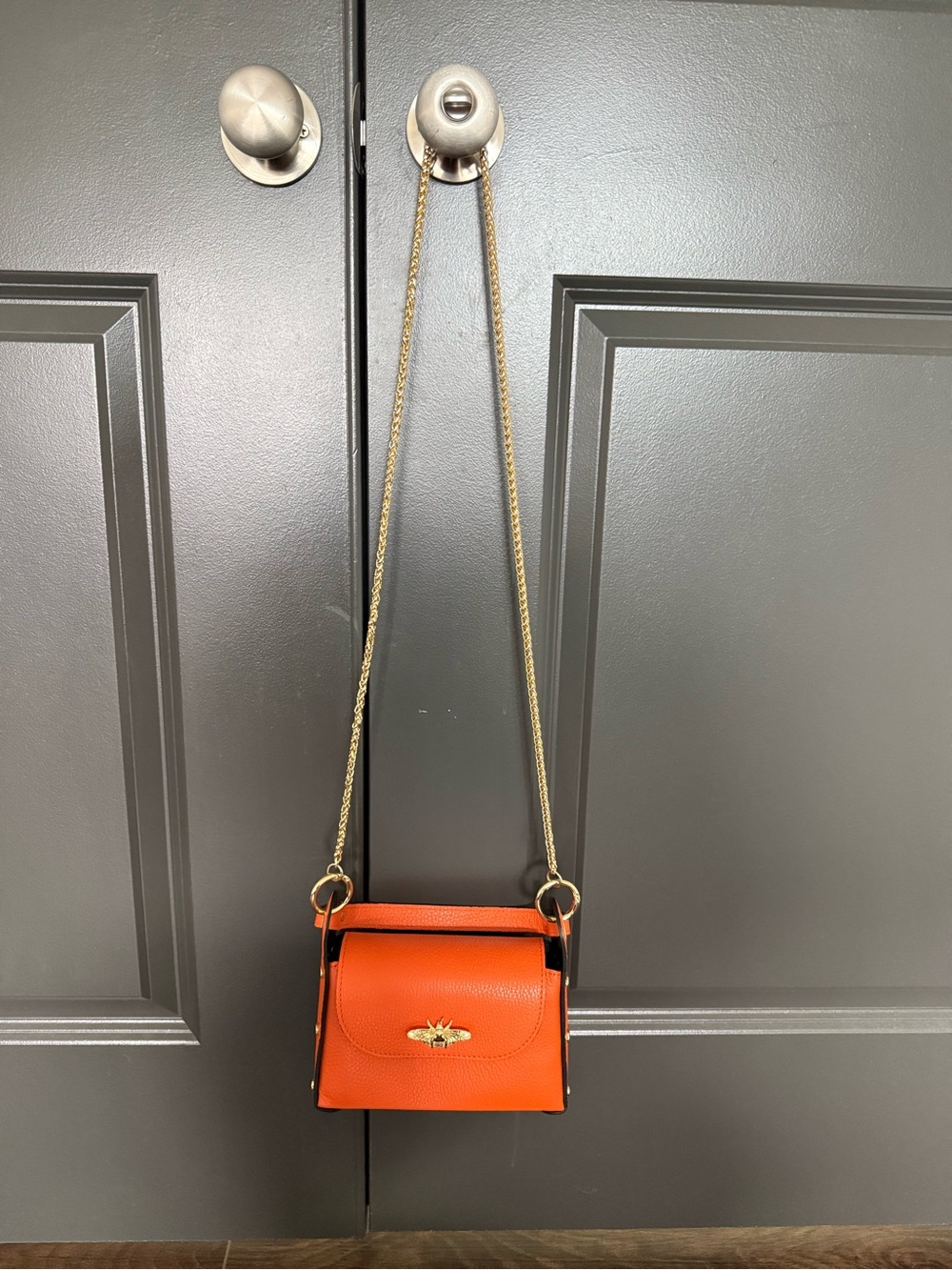 Leather Crossbody Bag in Orange with Gold Chain
